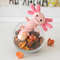 Small crocheted stuffed toy pink axolotl