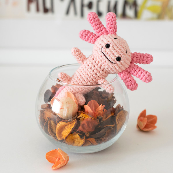 Small crocheted stuffed toy pink axolotl