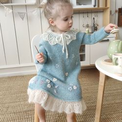 Knit wool dress for little girls with a collar and embroidery flowers.  Warm Baptist dress with long sleeves for baby