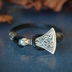 Viking bracelet with Mammen axe and beads on leather cord. Norse jewelry