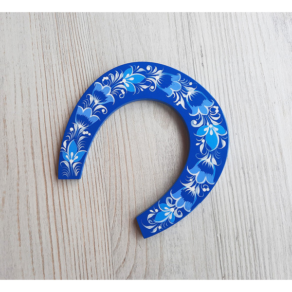 blue wooden souvenir Russian horseshoe hand painted
