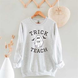 halloween trick or teach teacher crewneck sweatshirt, retro ghost halloween sweater, teacher ghost halloween gift, funny