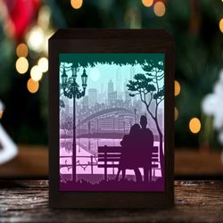couple sitting on bench light box