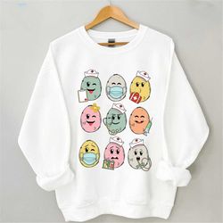 happy easter egg nurse, easter nurse shirt, nurse crew sweatshirt, nurse gift for easter day, easter shirt for woman, ha