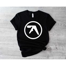 aphex twin shirt, aphex twin logo symbol t-shirt, british theme musician fandom concert top, irish singer sweater, richa