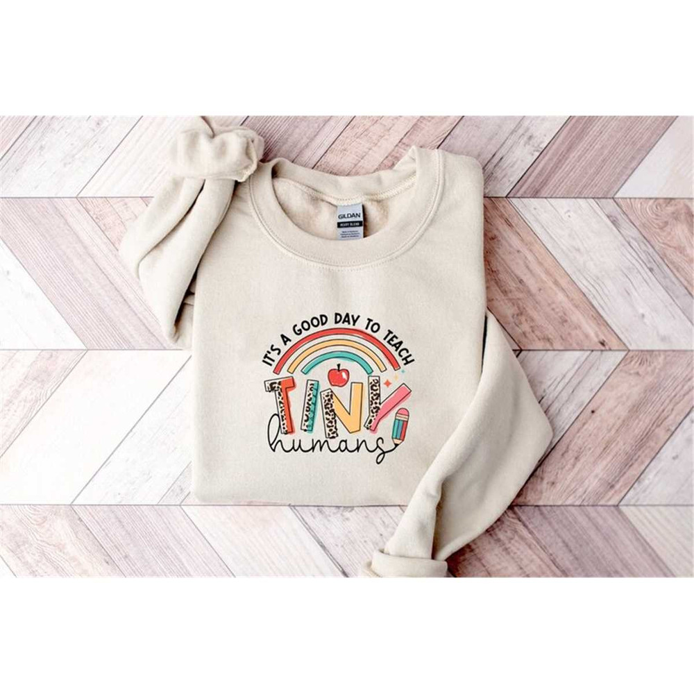 MR-315202394546-teacher-of-tiny-humans-sweatshirt-youth-crewneck-sweatshirt-image-1.jpg