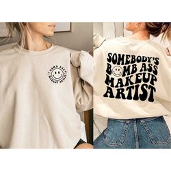 somebody's bomb ass makeup artist sweatshirt, smiley face shirt, makeup artist gift, make up artist gifts, trendy shirt