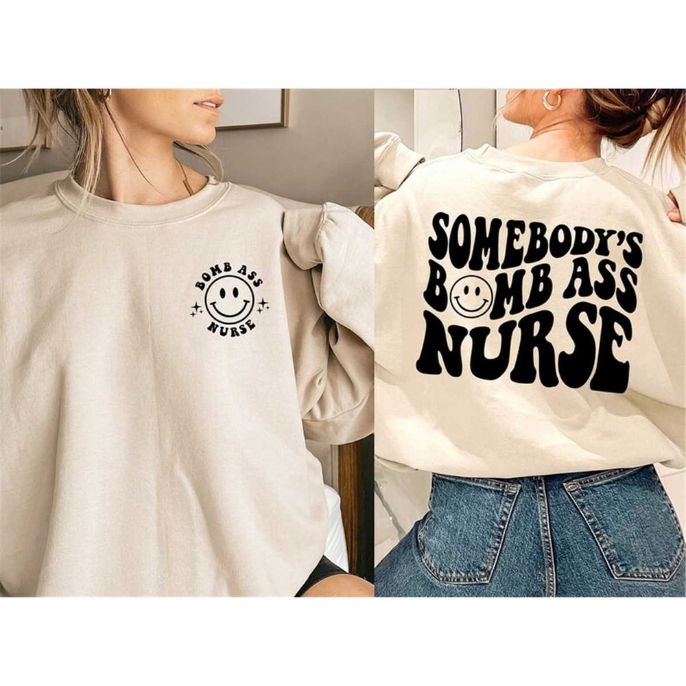 MR-162023164844-somebodys-bomb-ass-nurse-sweatshirt-cute-smiley-face-image-1.jpg