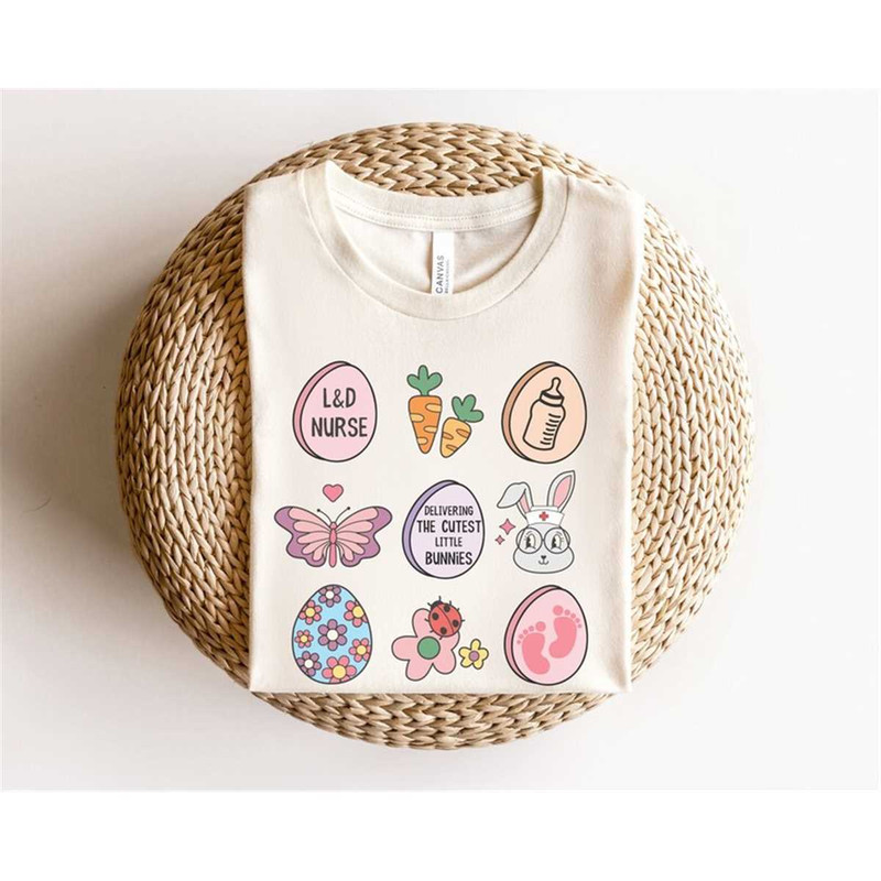MR-16202319438-easter-themed-labor-delivery-shirt-in-the-color-natural-3-by-3-graphics-of-eggs-carrots-a-butterfly-flower-and-rabbit.jpg