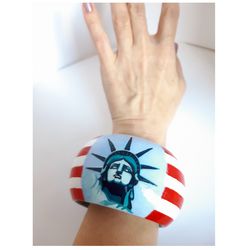 Wide wooden bracelet. bracelet with hand-painted American flag, decoration in patriotic style, symbol of the USA