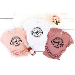 warning the girls are drinking again, girls trip shirt, girls night out shirt, alcoholic girls group shirt, funny girls