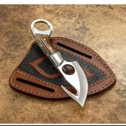 Handmade gut hook survival knife with wood handle and leather Carry.
