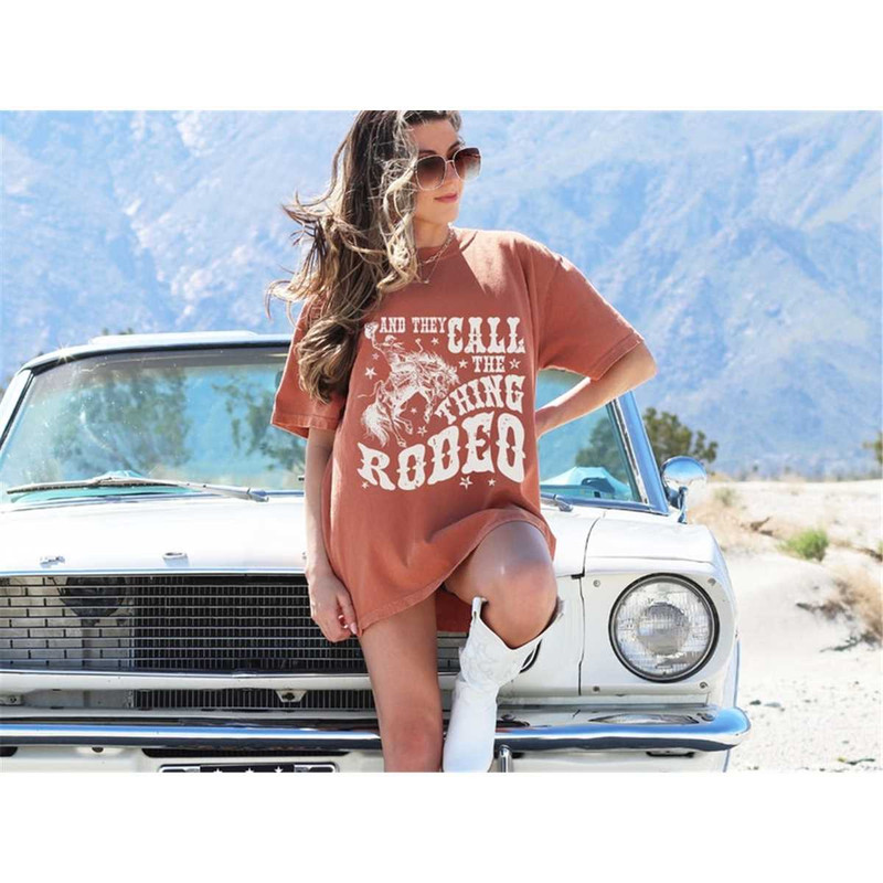 MR-86202313524-and-they-call-the-thing-rodeo-tee-comfort-colors-tee-rodeo-image-1.jpg