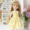 A 14-inch Ruby Red Fashion Friends doll doll in a cute lemon print dress