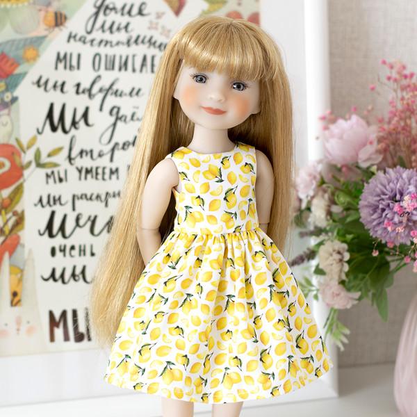 A 14-inch Ruby Red Fashion Friends doll doll in a cute lemon print dress