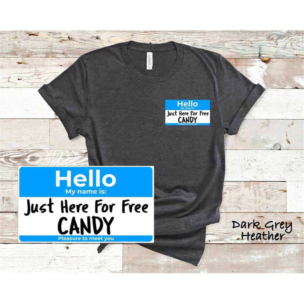 MR-14620231892-funny-halloween-name-tag-shirt-just-here-for-free-candy-dk-gry-heather-blu.jpg