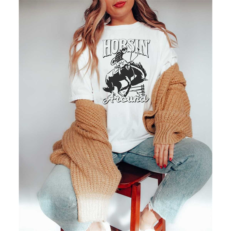 MR-1462023181332-horsin-around-tee-cowboy-tee-rodeo-cowgirl-tee-boho-tee-image-1.jpg