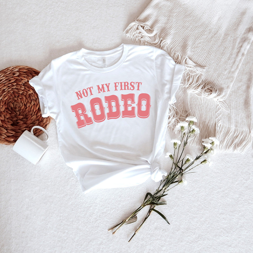 Not my first rodeo shirt, country shirt, western style shirts, rodeo graphic tee, cowgirl shirts, women’s rodeo - 1.jpg