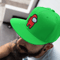 snapback-hat-mockup-of-a-guy-sitting-in-the-street-11841.png