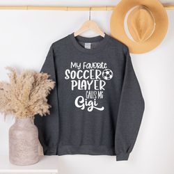 soccer gigi long sleeve shirt, my favorite soccer player calls me gigi sweatshirt, grandma hoodie gifts from soccer play