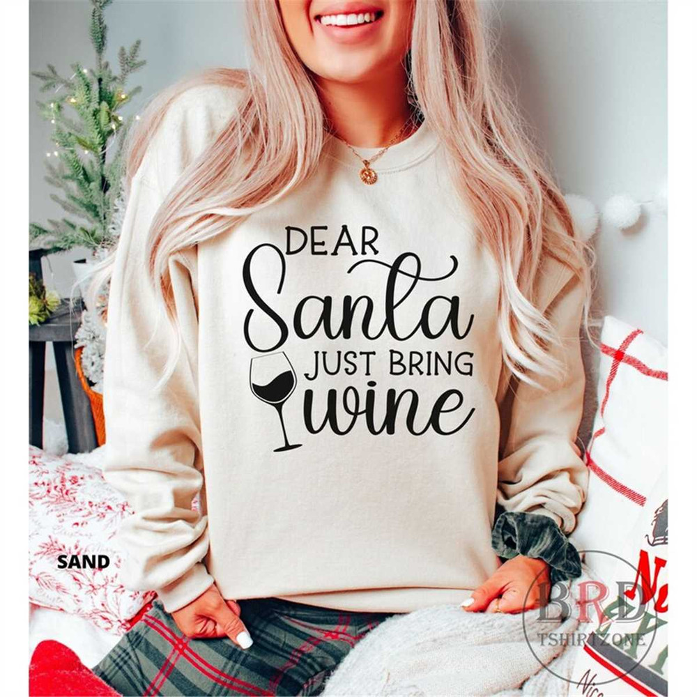 MR-1662023153137-santa-christmas-sweatshirt-christmas-wine-sweater-dear-santa-sand.jpg