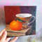12 Oil painting on Cardboard - Still life with a bright tangerine 5.8- 5.8 in (14.8-14.8 cm)..jpg