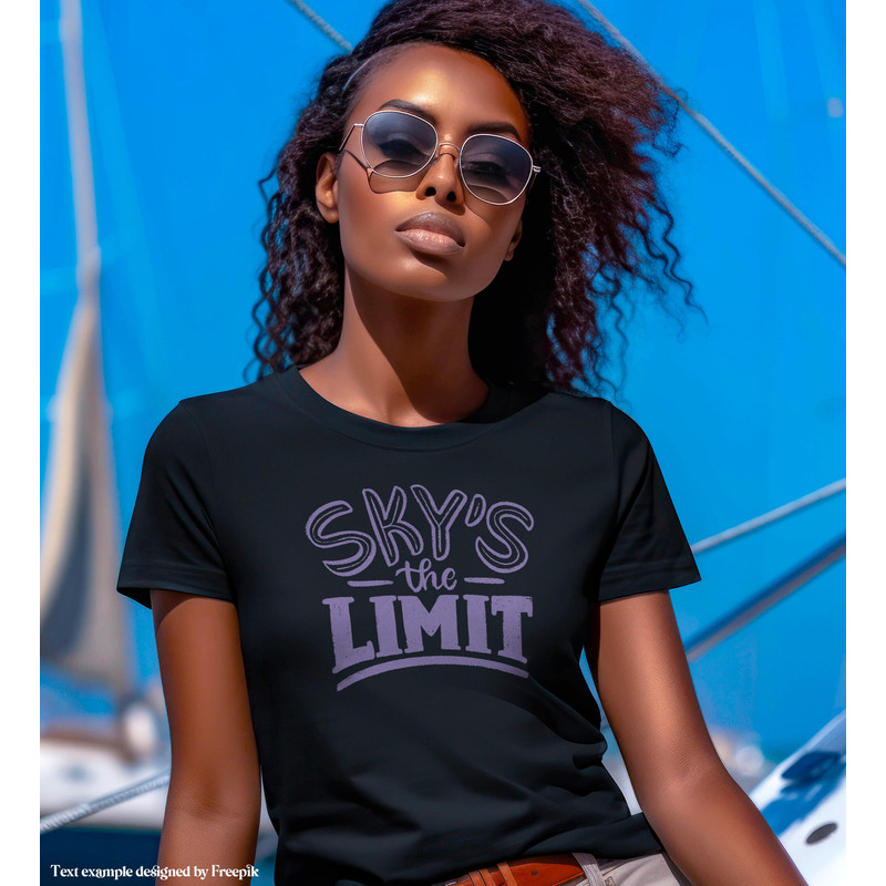 Mockup of a Woman wearing a Black Bella Canvas 3001 T-shirt, Female Model, Girl Styled Shirt Mockup, Nautical Tshirt w sailboat background - 2.jpg