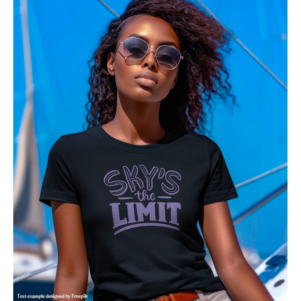 Mockup of a Woman wearing a Black Bella Canvas 3001 T-shirt, Female Model, Girl Styled Shirt Mockup, Nautical Tshirt w sailboat background - 2.jpg