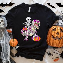 skeleton rides dinasour pumpkin shirt, halloween boy skeleton shirts, cool halloween sh