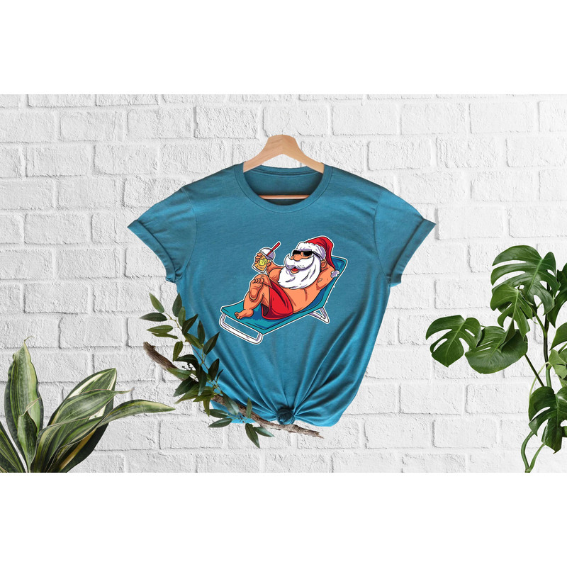 Christmas In July T-Shirt,Tropical Christmas, Santa At The Beach, Xmas In Summer Tees, Tropical Xmas, Funny Summer Vibes, Summer Santa Shirt - 1.jpg