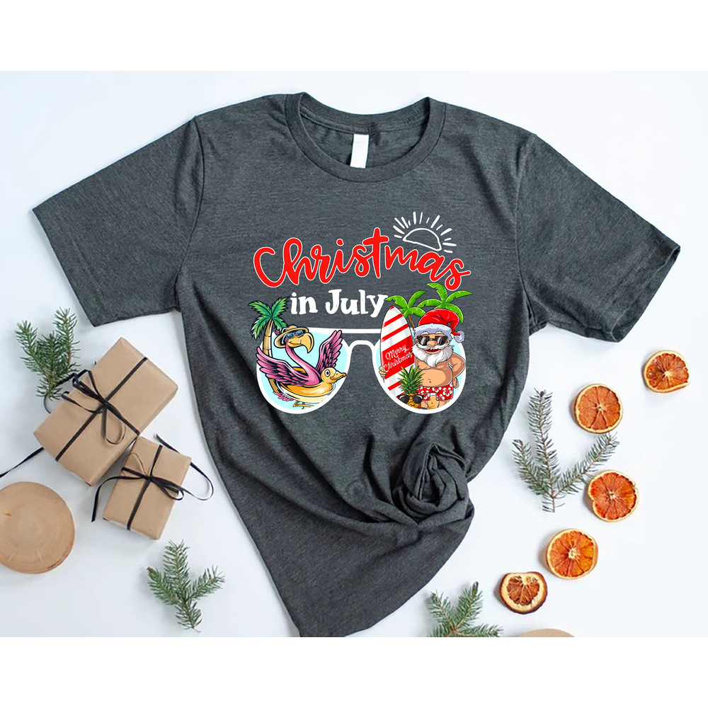 Christmas In July Shirt,Santa Beach Shirt,Summer Santa T-shirt,Christmas Flamingo Shirt,Christmas At The Beach,Xmas in July,Tropical Xmas - 1.jpg