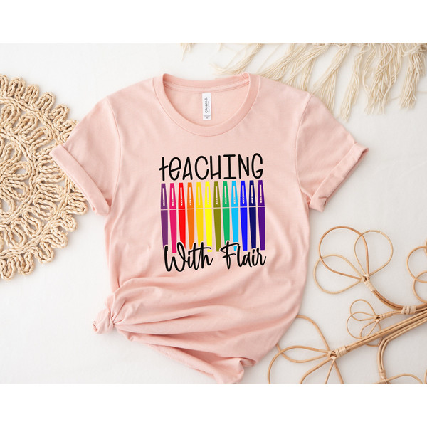 https://www.inspireuplift.com/resizer/?image=https://cdn.inspireuplift.com/uploads/images/seller_products/1688134531_TeachingWithFlairFlairPensTeacherShirtTeacherTeeTeachShirtTeacherT-ShirtsTeacherGiftFunnyTeacherShirtsFlairPenTee-1.jpg&width=600&height=600&quality=90&format=auto&fit=pad