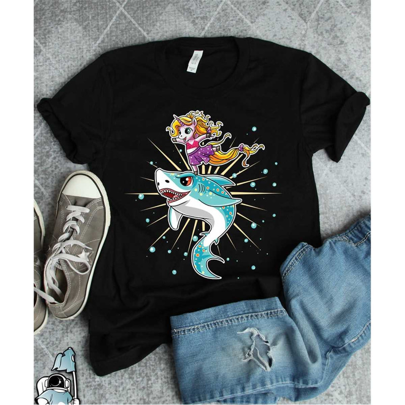 MR-3062023223644-unicorn-riding-shark-shirt-unicorn-shark-gift-unicorn-shirt-image-1.jpg