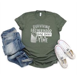 surviving fatherhood one beer at a time shirt, funny fathers day gift, funny dad t shirt, funny t shirt for dad, father'