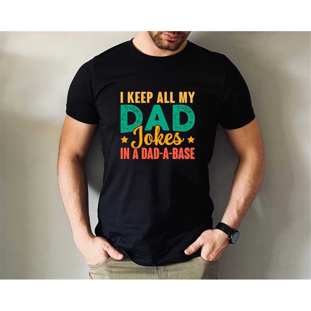 MR-57202317940-i-keep-all-my-dad-jokes-in-a-dad-a-base-shirt-fathers-day-image-1.jpg