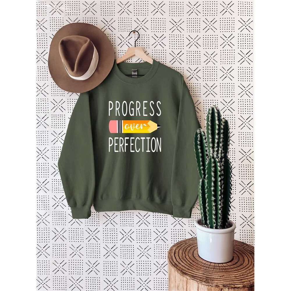 MR-67202382155-progress-over-perfection-sweatshirt-back-to-school-image-1.jpg