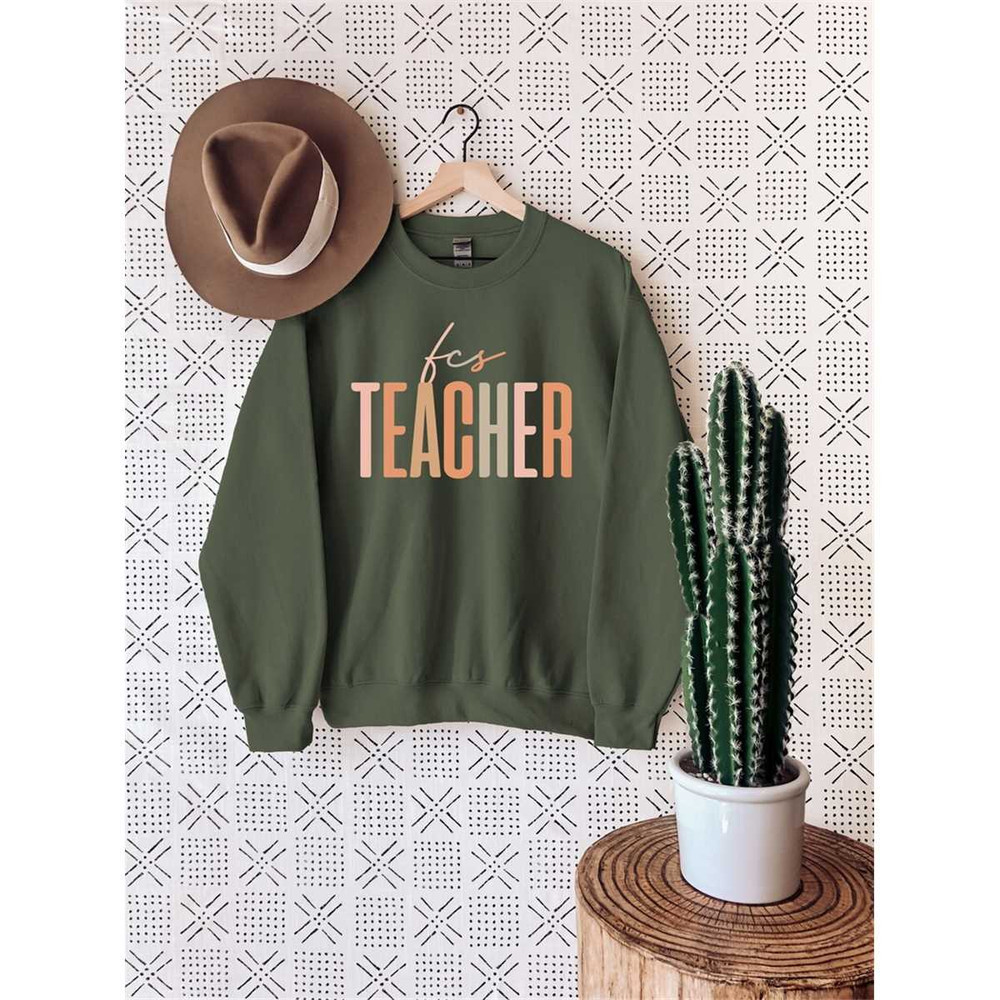 MR-6720238237-family-and-consumer-science-teacher-sweatshirt-teacher-image-1.jpg