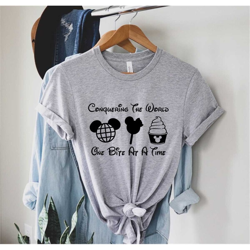 MR-77202393548-conquering-the-world-one-bite-at-a-time-disney-tee-epcot-image-1.jpg