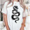 MR10720239270reputationsnaketaylorswiftshirtreputationnewspaperimage1jpg