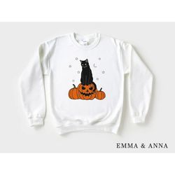 halloween shirt, halloween sweater, cat on pumpkin shirt, black cat shirt, halloween crewneck, black cat shirt ..