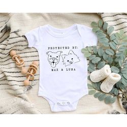 protected by dog onesie, custom dog breed onesie, personalized dog name baby onesie, dog sibling outfit, baby shower gif