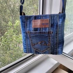pretty little handmade denim crossbody bag with adjustable strap and 3 pockets, lined with cotton