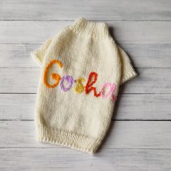 Handmade personalized dog sweater with embroidered dog name