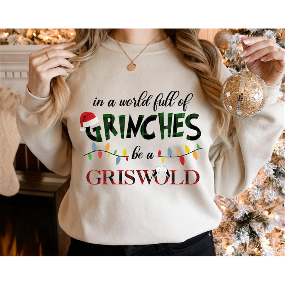 MR-58202392237-in-a-world-full-of-grinches-be-a-griswold-sweatshirt-grinch-image-1.jpg