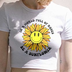 in a world full of roses be a sunflower svg