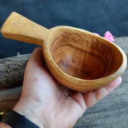 Handmade wooden kuksa cup from birch wood for tea or coffee