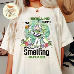 smelling flowers and smelling buzzed shirt, let the magic blossom shirt, disney epcot flower and garden festival, buzz l
