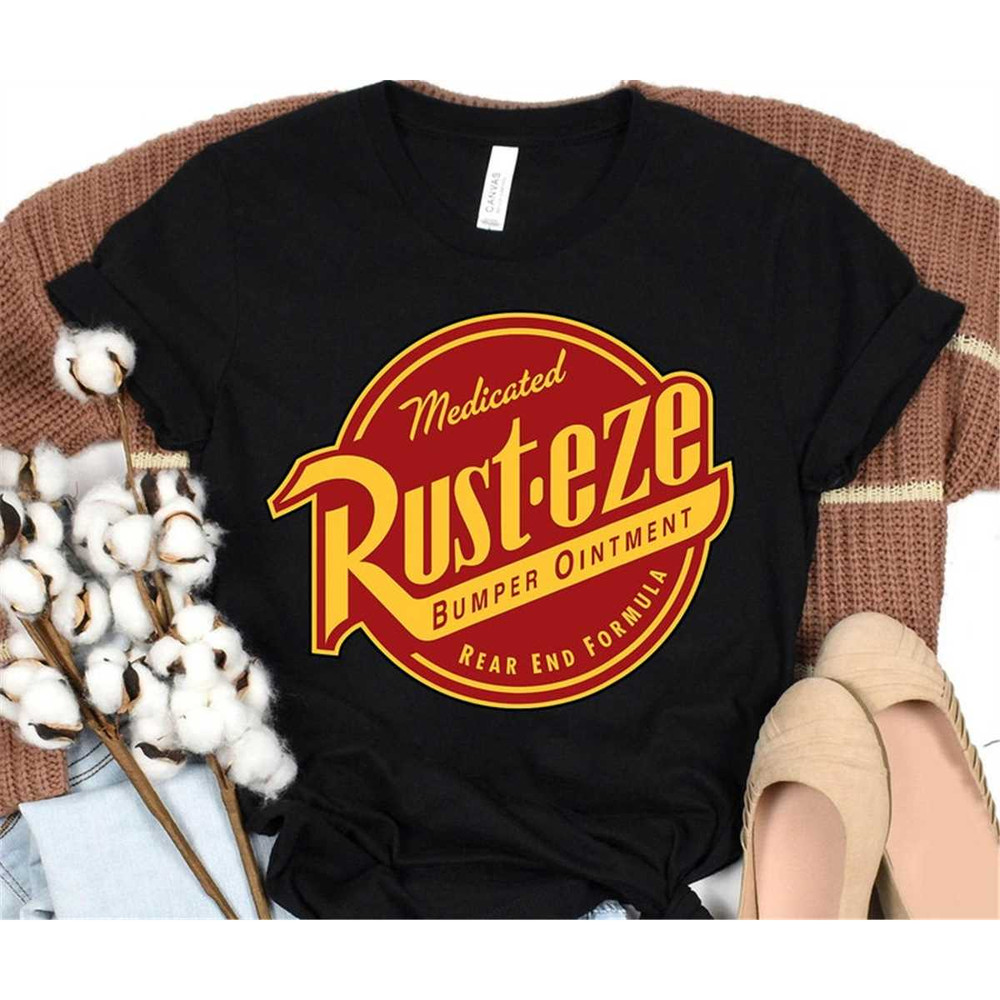 MR-118202315935-disney-pixar-cars-2-rust-eze-ointment-logo-graphic-t-shirt-image-1.jpg