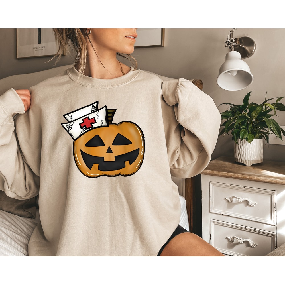 Halloween Pumpkin Nurse Shirt, Spooky Nurse Sweatshirt, Halloween Gifts for Nurse, Nurse Horror Shirt, Pumpkin Face Nurse Shirt - 1.jpg