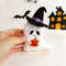 Felt toy - ghost in pointed hat with orange Halloween pumpkin in the author's hand